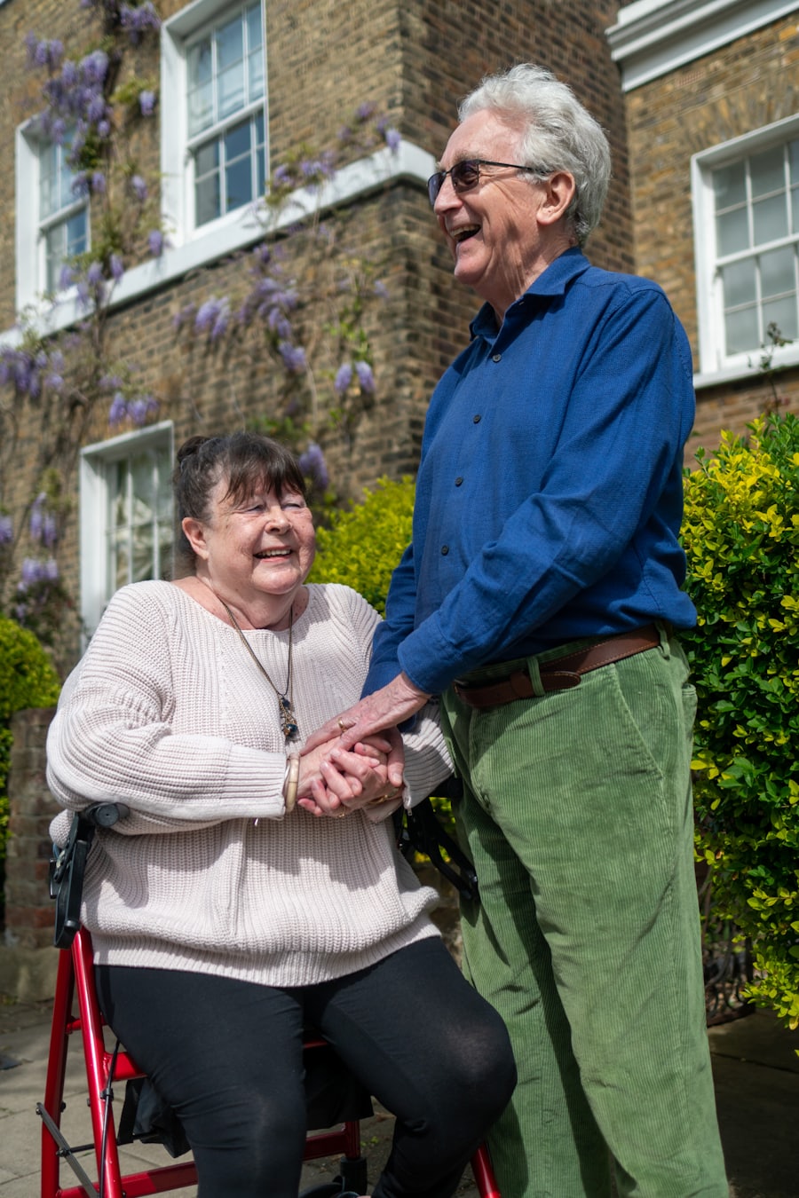 An older British couple smiling together outside their home